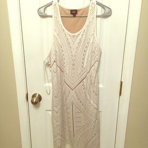 Ladies cream print and nude lining dress.